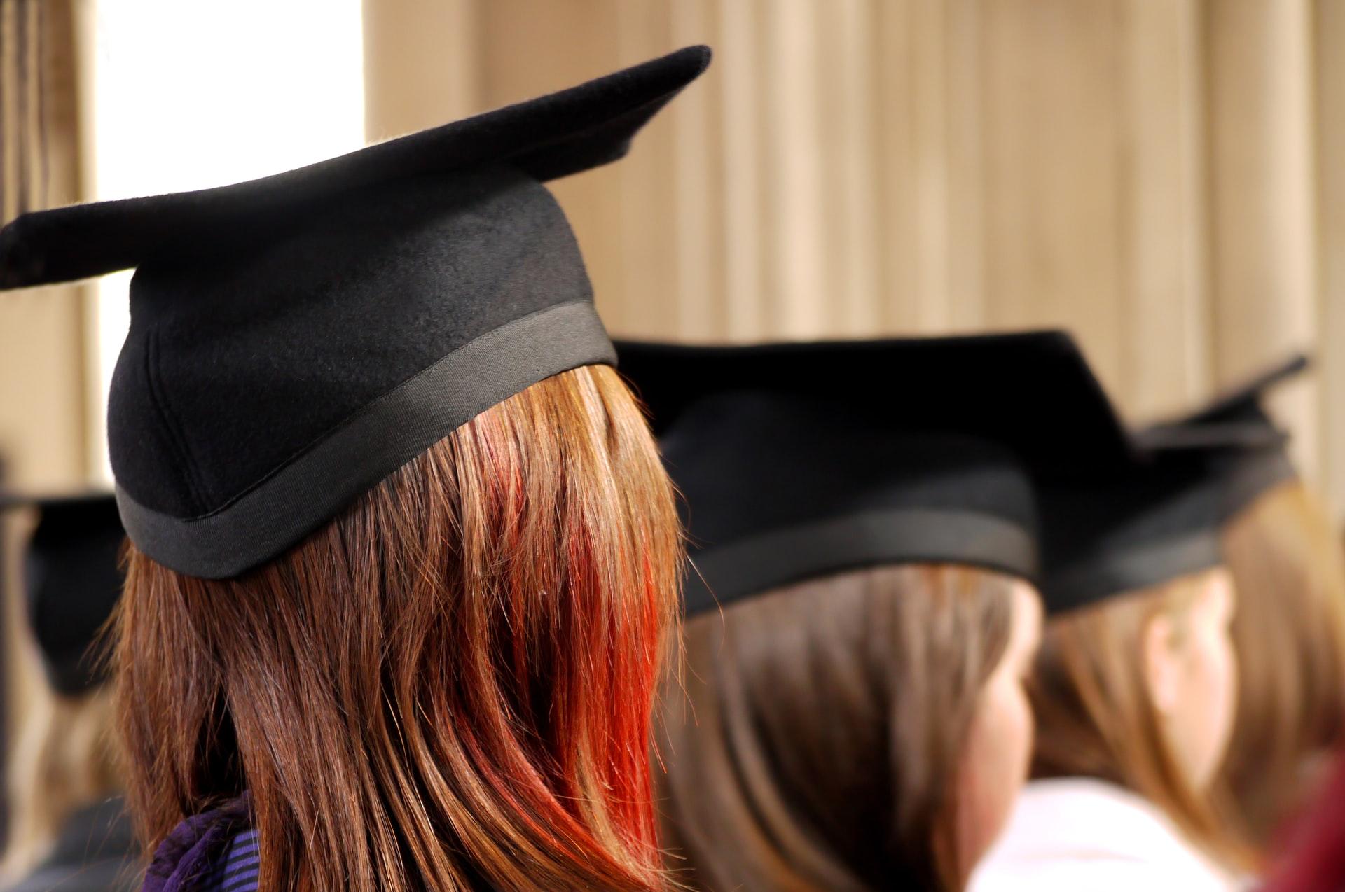 women on square academic caps